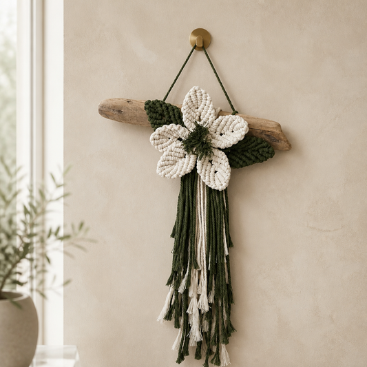 Single macrame flower on driftwood